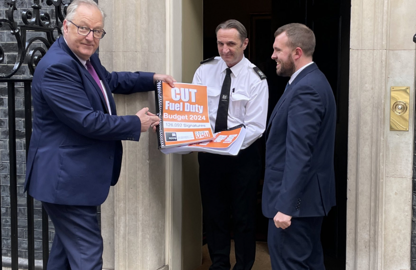 Jonathan Gullis outside 10 Downing Street holding a petition