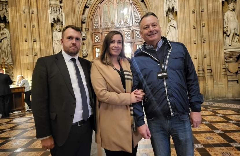 Jonathan standing with Sharlotte's family 