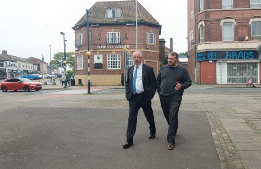 Jonathan walking with Police, Crime and Fire Commissioner