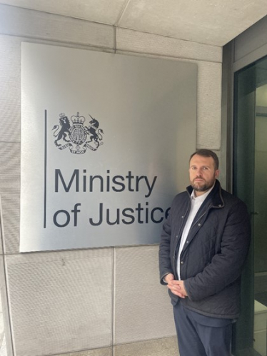 Jonathan at entrance to Ministry for Justice