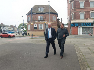 Jonathan walking with Police, Crime and Fire Commissioner